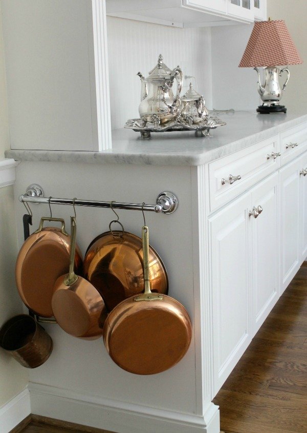 Towel bar to organize pots and pans.
