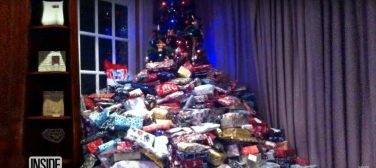 Image of Christmas tree with lots of gifts.