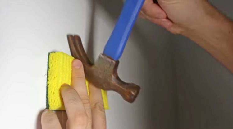 Use sponge to protect wall when pulling out nails