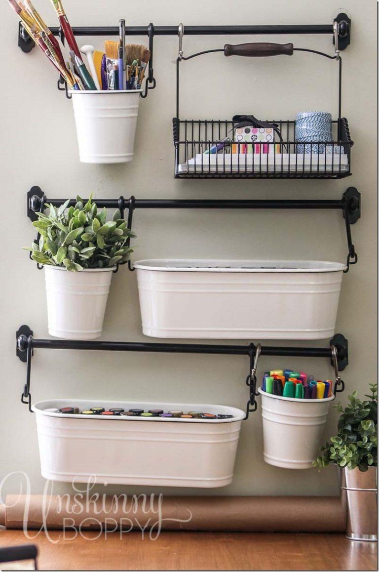 Organized craft supplies on towel bar.