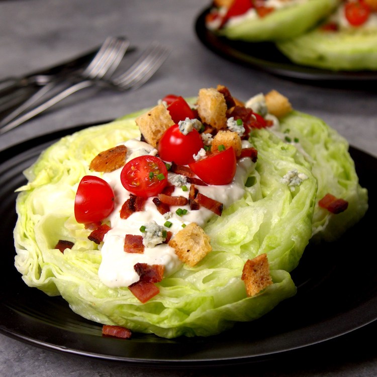 Chilled, crisp iceberg lettuce covered in creamy blue cheese dressing, bacon, croutons, & tomatoes--plus one new twist that makes this the ultimate wedge salad.
