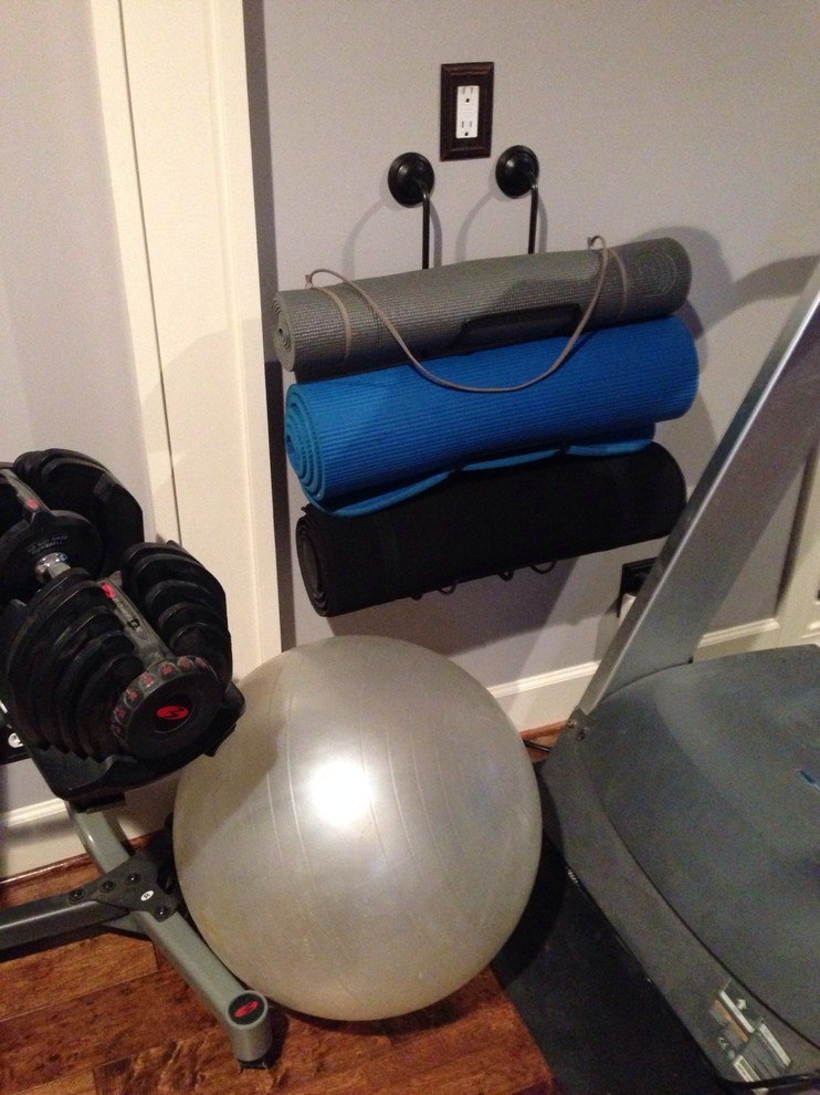 Hanging yoga mats on towel bars.