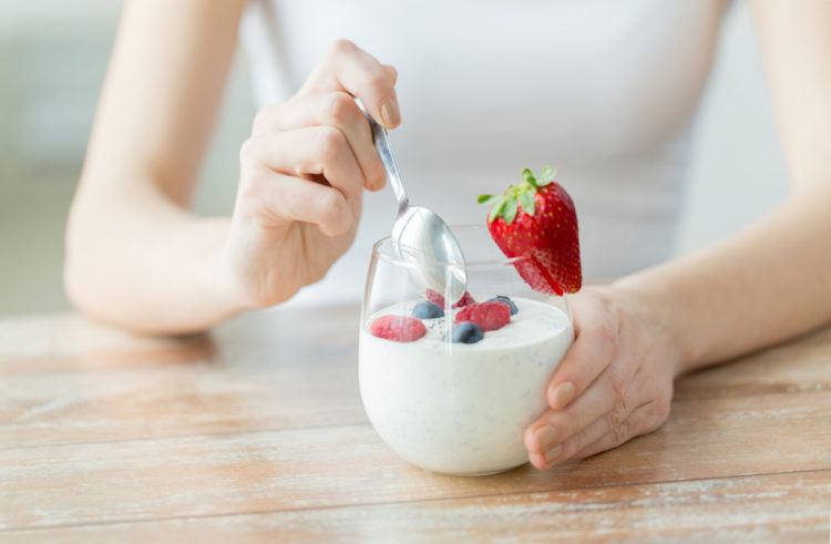 Woman Eating Yogurt