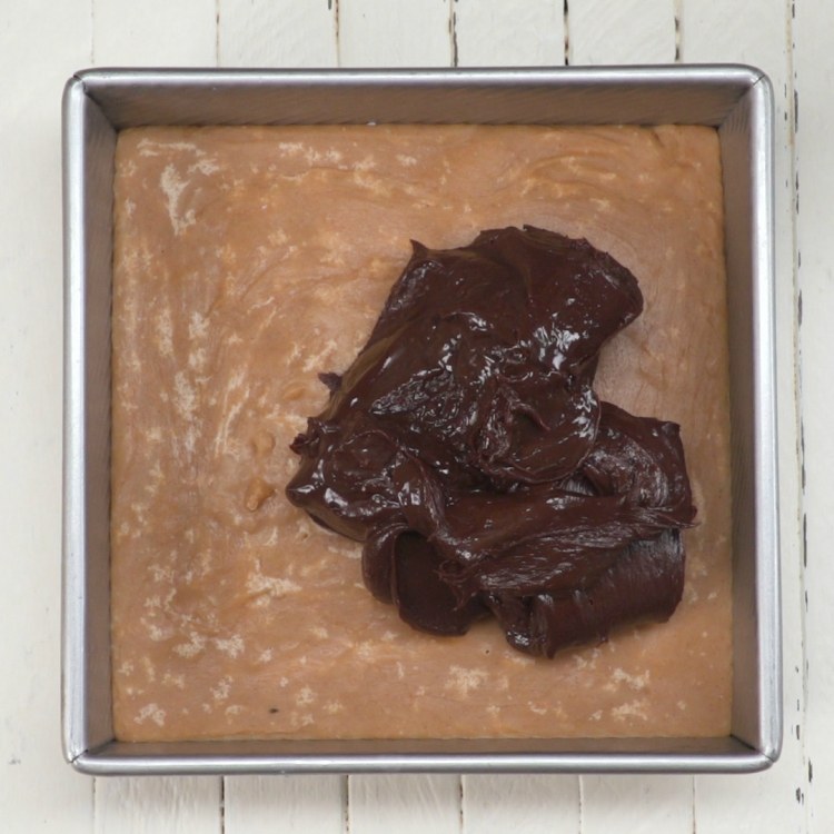 Pour the chocolate fudge layer evenly over the peanut butter fudge layer