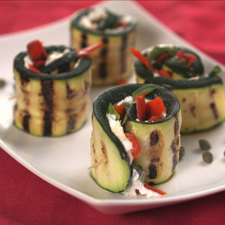 Grilled zucchini rolls with goat cheese, capers and peppers