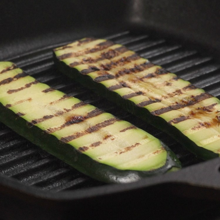 Grilling zucchini slices to make zucchini rolls