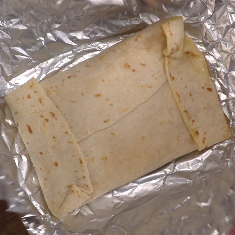 Easy, portable breakfast pockets stuffed with ham, gooey melted cheese, and a perfectly-done baked egg. The best part is, there's absolutely zero clean-up.