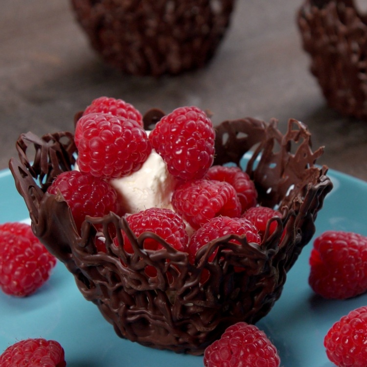 Bowl made out of chocolate on a blue plate