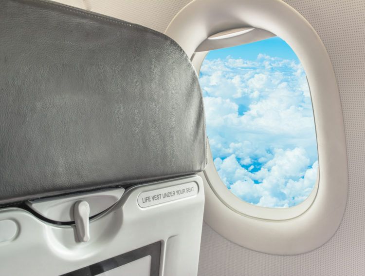 Image of window seat view with tray table.