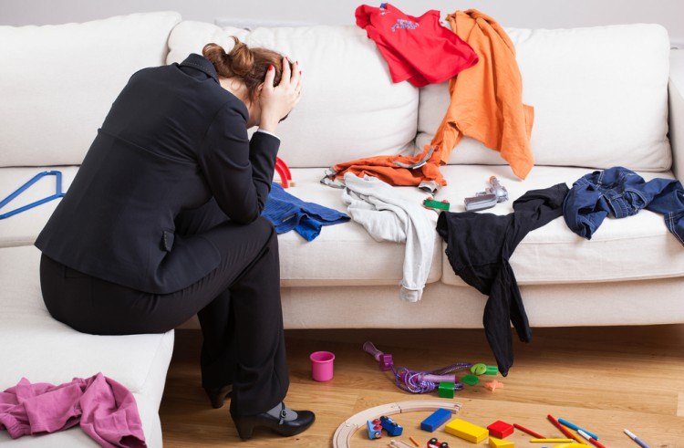 Mom upset in messy room.