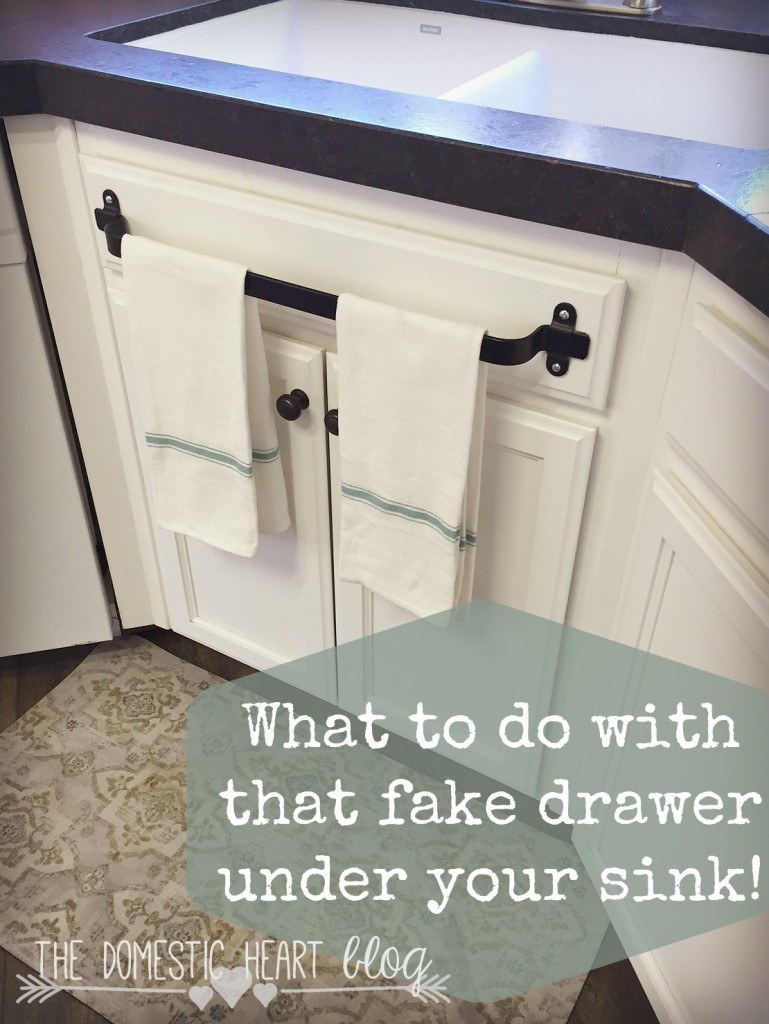 Towel bar on fake kitchen drawer.