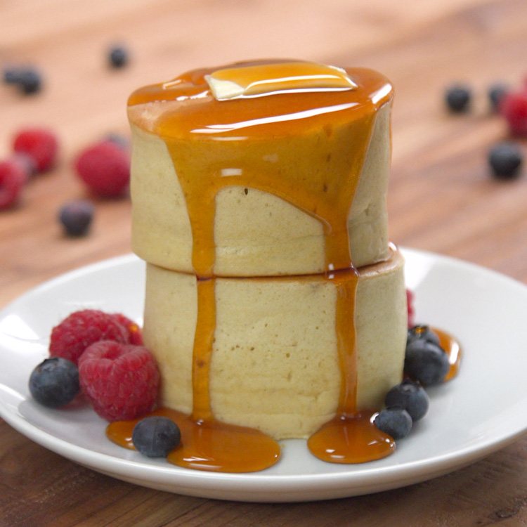 Japanese Pancakes plated with berries and syrup