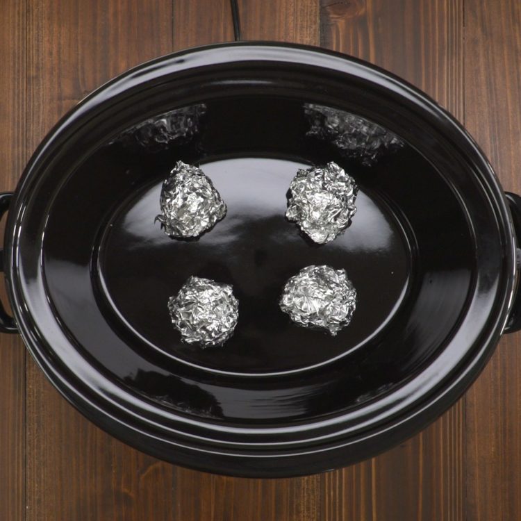 Slow Cooker Whole Chicken balls of foil