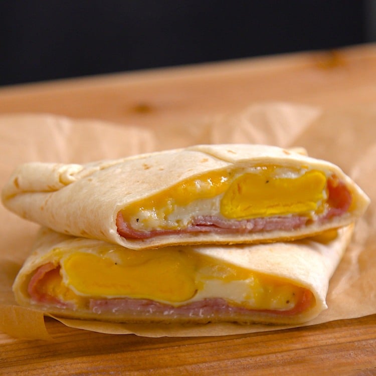 Easy, portable breakfast pockets stuffed with ham, gooey melted cheese, and a perfectly-done baked egg. The best part is, there's absolutely zero clean-up.