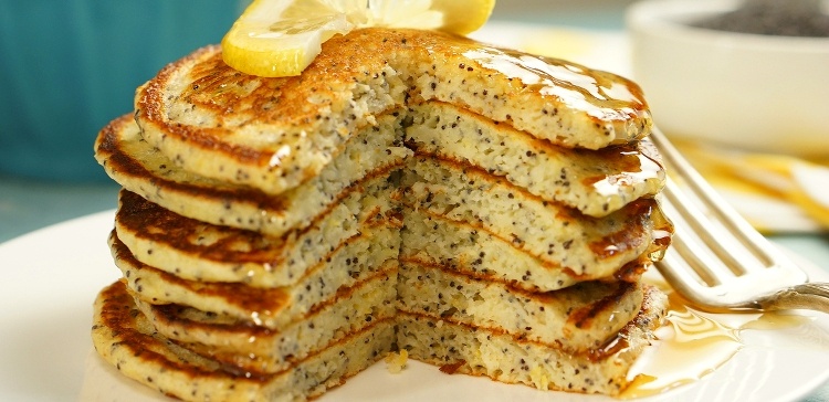Fluffy buttermilk pancakes zing with bright lemony flavor from real lemon zest and juice, and plenty of poppy seeds add a subtle crunch.