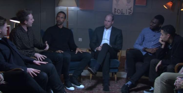 Image of Prince William speaking with support group team.
