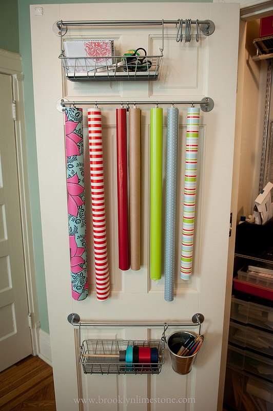 Gift wrap organized on towel bar.