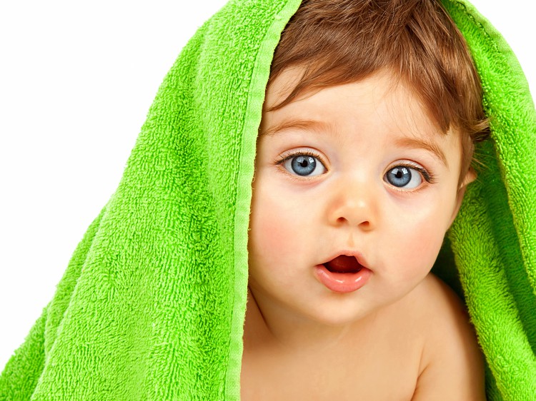 Image of baby boy with towel.