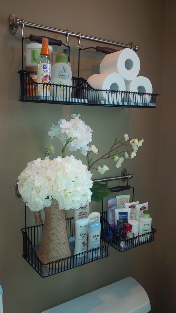 Bathroom toiletries hanging above toilet.