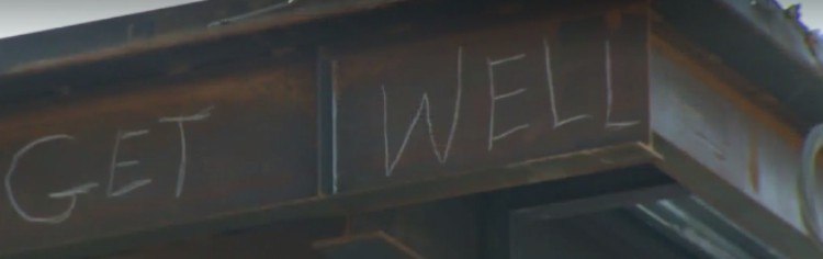 Get well sign written on I-beam