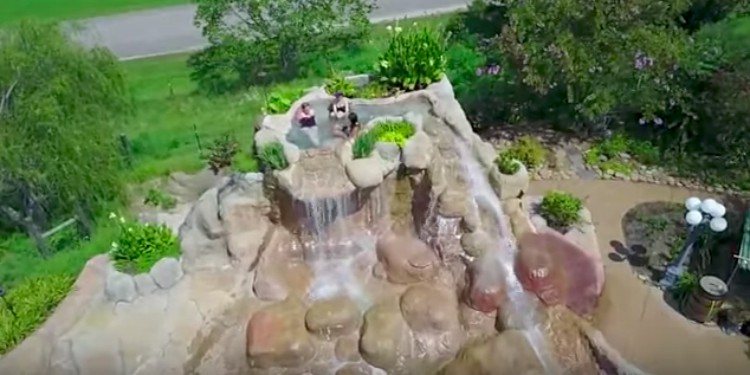 people in rock jacuzzi
