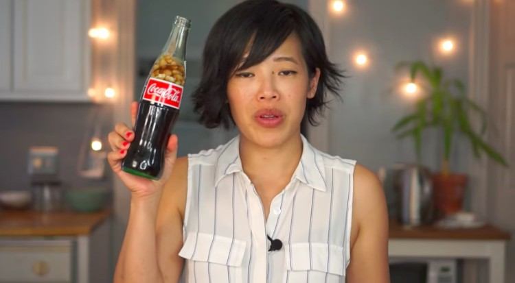 emmy holding up coke and peanuts