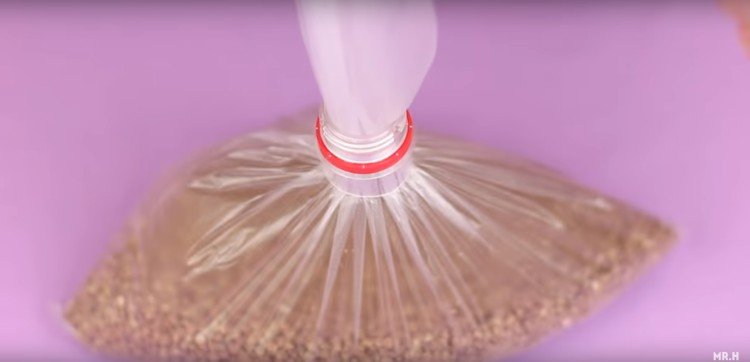 Using a bottle top for a bag funnel.