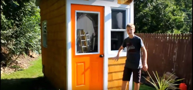 Image of child with tiny house.
