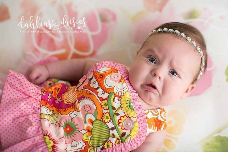 newborn pink frown