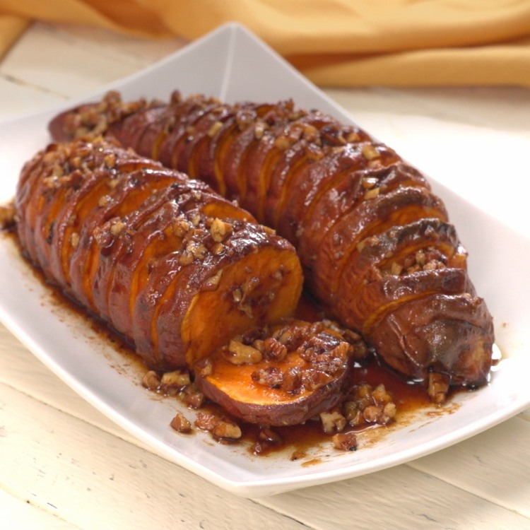 Hasselback Maple Pecan Sweet Potatoes on white plate