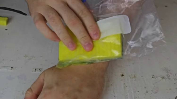Soak sponge in water and freeze to make DIY ice pack